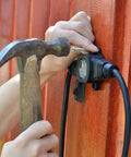 Installing 25ft Weatherproof Outdoor Extension Cord With Four Evenly Spaced Inline Outlets LED Indicator on wooden wall
