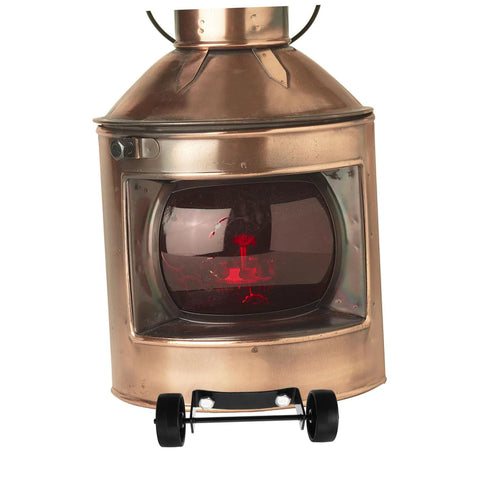 Patio heater caster wheels, black plastic, two wheels visible under copper outdoor heater base