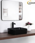 Matte Black Rectangle Vessel Sink 19 By 15 Inch Above Counter Bathroom Sink Porcelain Ceramic Small Bowl For Bathrooms Modern Sleek Dope European Inspired Style Durable Black Ceramic Vessel For Contemporary Vanities on wooden countertop with mirror reflection