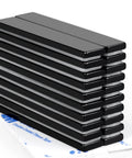 Front view of a stack of 20 black epoxy neodymium magnet bars with double-sided adhesive, 60 x 10 x 3 mm.