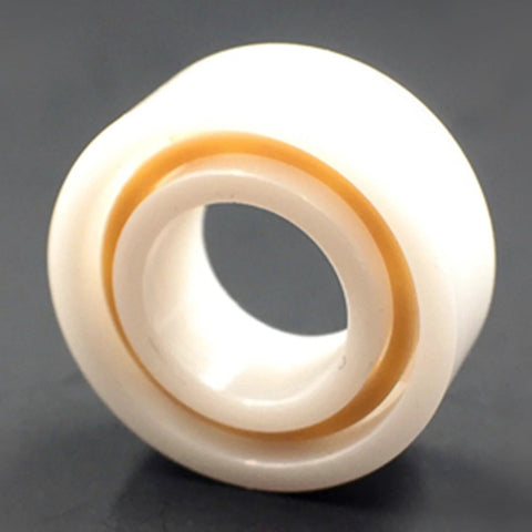 R188 full ceramic ball bearing, front view, white outer race with orange seal, 1/4 in x 1/2 in x 3/16 in.