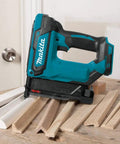 Cordless 18V LXT 23 Gauge Pin Nailer Pro Grade on table with trim pieces, drives six lengths, woodworking tool.