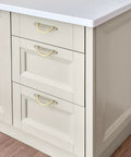 Brushed Brass And Brushed Nickel Cabinet Pulls 5 Inch Center To Center Curved Handles installed on white kitchen drawers.