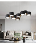 Sleek Modern Led Pendant Light For Kitchen And Dining Room With Dope Iron Frame And Killer Warm Glow Smooth Acrylic Shades Dimmable Switch For Chill Home Vibes, featuring multiple black shades, in a stylish living room.