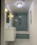 Bathroom with Three Light Crystal Chandelier With Brass Finish Flush Mount Ceiling Light Fixture highlighting blue tile shower.
