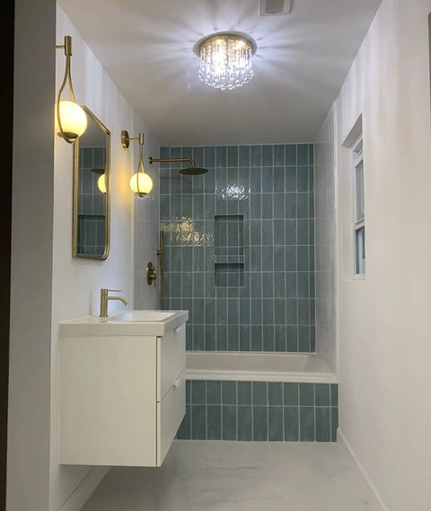 Bathroom with Three Light Crystal Chandelier With Brass Finish Flush Mount Ceiling Light Fixture highlighting blue tile shower.