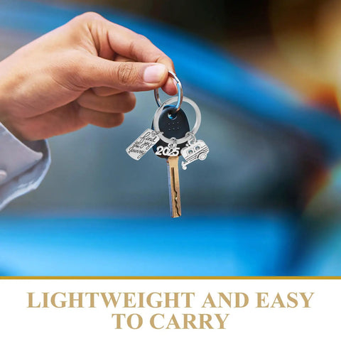 Hand holding Travel Themed Camper Keychain Easy On Off Zinc Alloy Charm For RV Lovers And Outdoor Adventurers Perfect Gift For Explorers