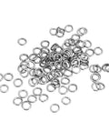 100 Pcs M4 304 Stainless Steel Split Lock Washers Set scattered on a white surface
