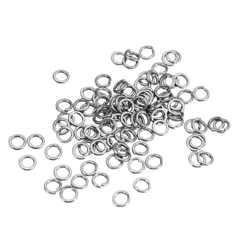 100 Pcs M4 304 Stainless Steel Split Lock Washers Set scattered on a white surface