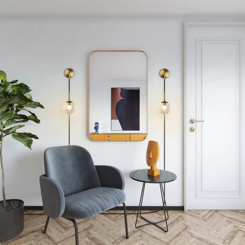 Plug In Wall Sconce Set Of 2 Modern Glass Globe Lights With Brushed Brass Finish displayed in living room setting