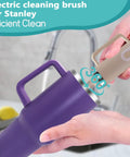 5 In 1 Electric Bottle Brush Cleaner Dual Speed Rechargeable IPX6 Waterproof in use on a purple mug, showing effortless cleaning