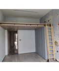 Retractable Sliding Ladder Hardware Kit With Solid Wood Ladder For Barn Doors, Loft And Library Track System, installed in a home loft