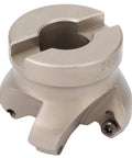 Side view of four-flute face milling cutter in silver metal with mounting screws and clamp slots.