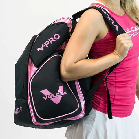 VPRO Pickleball Backpack For On Court Gear, Dope Black Pink Sport Tote with padded laptop compartment on woman's shoulder