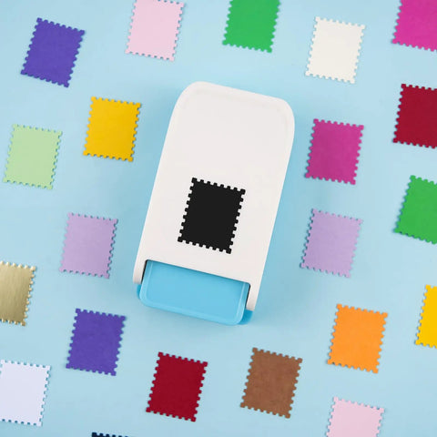 Rectangular Postage Stamp Punch 1x0.8 Inch With Scalloped Edge, Lever Action Paper Punch surrounded by colorful paper samples.