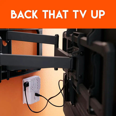 Wall Charger Surge Protector With Four Pivoting AC Outlets And Two USB Ports, 1080 Joules Of Protection in use behind TV