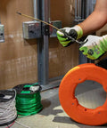 Top Shelf 13 Inch Flexible Fish Tape Leader for 1/8 Inch Steel Tapes in use, guiding cable through bends with durable materials.