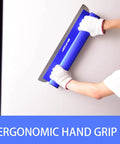 Person using Pro Grade Skimming Blade Set For Drywall With Outer Case - 8 Inch, ergonomic hand grip on wall