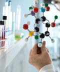 Person using Hands On Molecular Model Kit For Students With 207 Pieces Including 79 Atoms, 18 Electron Cloud Orbitals And 110 Bond Links