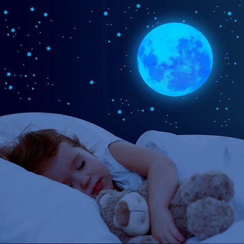 Child sleeping under Night Sky Glow Stars Ceiling Stickers Kit With 1049 Pieces Including Moon And Stars, Self Adhesive Wall Decals