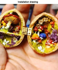 Open walnut shell showing small mushrooms and flora, connected by a hinge, resembling a tiny woodland scene.