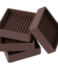 Super Grippy Non Slip Furniture Caster Cups 2x2 Inch Square Floor Protectors For Hardwood Tile Laminate Vinyl stacked for use.