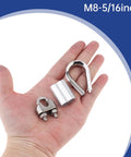 Hand holding components of 24 Piece M8 Wire Rope Cable Clamp Ferrule Kit with five sixteenth inch clamp, thimble, and sleeve.