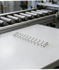 Two Pack Industrial Trapezoidal Flat Compression Springs 1x9.5x35x160mm on machinery table