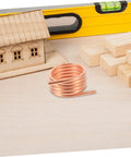 Coiled copper tubing for RC Boat Motor Cooling Jacket Metal Water Cooling Ring installation on wooden surface