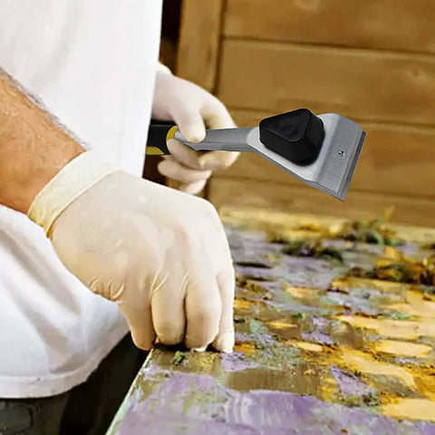 Person using Two Point Five Inch Carbide Razor Blade Paint Remover Scraper for decks floors wood varnish and glue removal