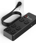 Heavy Duty Metal Power Strip Featuring Six Hella Durable Outlets And Big Time 3000 Joule Surge Protection For Computers Tools And Home Gear Along With A Smooth Six Foot Black Cord with black cord attached to outlet.