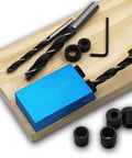 Carpentry Locator Jig For 15 Degree Dowel Drilling Kit With 6 8 And 10mm Drive Adapters displayed on wooden board.