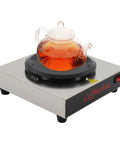 Keep Your Morning Brew Piping Hot With This Rugged Stainless Steel Coffee Warmer Plate featuring a glass teapot.