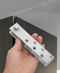 Hand holding 360 Degree Hidden Door Pivot Hinge System For Bookcases And Secret Doors Heavy Duty Stainless Steel Concealed Hinges