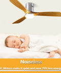 52 Inch Yellow Wood Hugger Ceiling Fan With Light And Remote shown above a sleeping baby in a quiet bedroom.