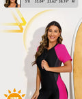 Model wearing Womens Boyleg One Piece Rash Guard With Built In Bra And Zip Front UPF 50 Plus Short Sleeve Surfing Swimsuit Neon Pink