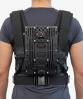 Back view of Thanos X Gimbal Support Vest System Steadicam Rig for DJI RS4 Pro RS3 RS2 With V Mount Battery on person.