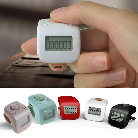 Slick Silicone Finger Clicker With Silent Button And Usb Charging Six Channel Led Screen For Prayer Beads Tally Tracking No Sweat Design in white, held on a finger.