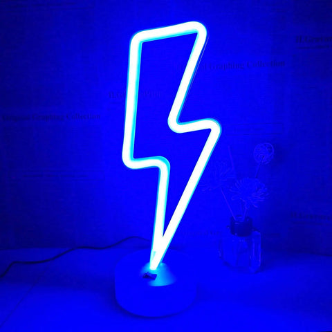 Lit Lightning Bolt Neon Sign With Base USB And Battery Powered Blue LED Light For Bedroom Decor on desk with blue glow