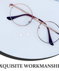 Push In Silicone Nose Pads For Glasses 50 Pack Non Slip Waterdrop Cushions Transparent Anti Sweat Replacement Inserts Super Grippy view with glasses and two pads.