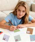 Girl writing on Cat Themed Sticky Notes 9 Pack 450 Sheets Lined Post It Notes Self Adhering Memo Pads For Office School Home Essentials