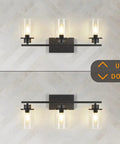 Slick Black 3 Light Vanity Light Fixtures Over Mirror With Clear Glass Shades mounted on wall, modern industrial farmhouse style