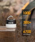 Rechargeable Camping Lantern 1000 Lumen LED Light With 6700mAh Power Bank shown outdoors on wooden table