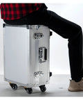 Rugged Alloy Toolbox With Built In Handle And Rolling Trolley, person sitting on portable hard case for tools and gear