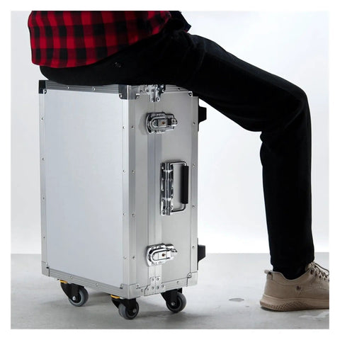 Rugged Alloy Toolbox With Built In Handle And Rolling Trolley, person sitting on portable hard case for tools and gear