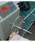 User operating a Badass Automatic Cable Winding Reel for USB cords and phone lines, efficiently spooling 4mm-10mm wire.