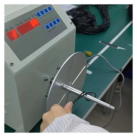 User operating a Badass Automatic Cable Winding Reel for USB cords and phone lines, efficiently spooling 4mm-10mm wire.