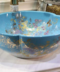 USZWBY Bathroom Vessel Sink, Countertop Basin Ceramic Sink in blue, round basin with floral golden designs for bathroom use.