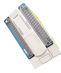 Heavy Duty PLC Controller With DC24V Relay Output For Smooth Industrial Automation And Production Line Control Built Tough For Relentless Machine Tool Operations On Any Bustling Shop Floor, top view showing connections and sealed casing.