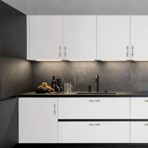 Stylish kitchen with 10 Pack 3 Inch Cabinet Handles in Brushed Nickel and Gold Finish on white cabinets, enhancing modern decor.